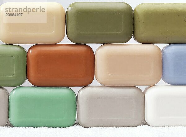 Different soap bars with healthy natural ingredients on white background