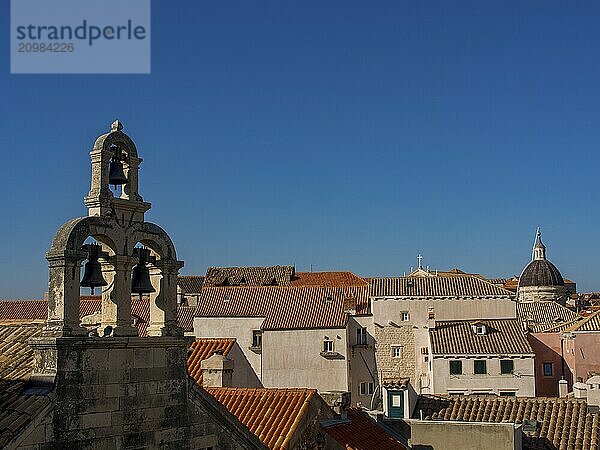 Historic city skyline with church tower and dome  surrounded by rooftops and clear sky  dubrovnik  Mediterranean Sea  Croatia  Europe