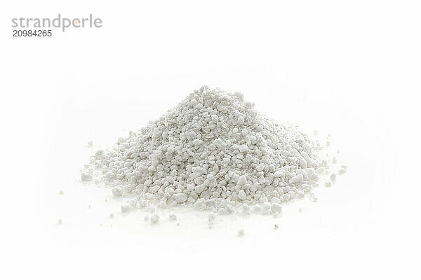 Perlite granules  soil amendment mineral used in horticulture and gardening. Closeup of an isolated cone pile on white studio background