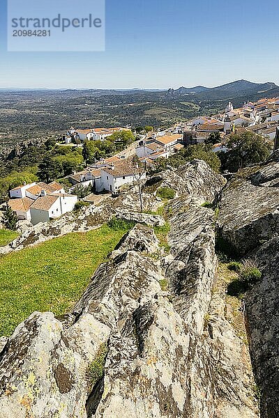 View of Marvao village with beautiful houses and church with rocky landscape mountains behind