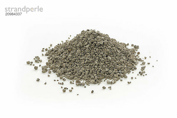 Garden gypsum granules  soil amendment  organic fertilizer  mineral used in horticulture and gardening. Closeup of an isolated cone pile on white studio background