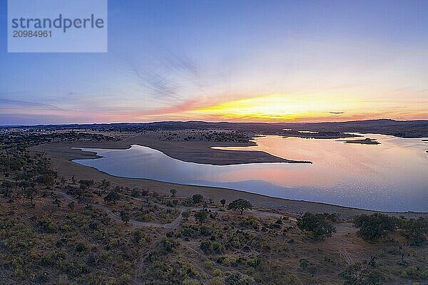 Drone aerial panorama of a dam lake reservoir at sunset in Terena  Portugal  Europe