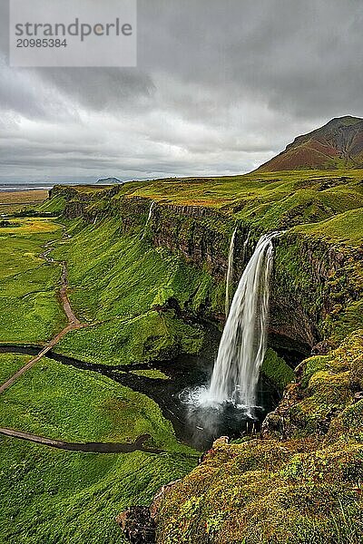 Seljalandsfoss waterfall in a cloudy day seen from above  Iceland  Europe