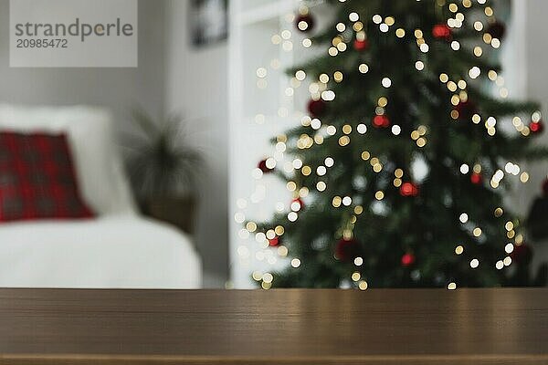 Christmas  New Year background with copy space for design. Empty wooden tabletop surface  blurred Christmas fir tree composition  bokeh sparkle lights effect. Mockup ready for product montage