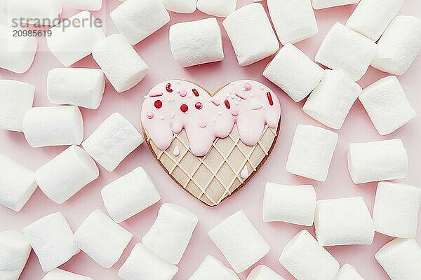 Melt ice cream heart gingerbread cookie  marshmallow. Valentine. Pink background.