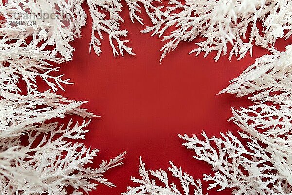 Different Christmas decorations on the red background.