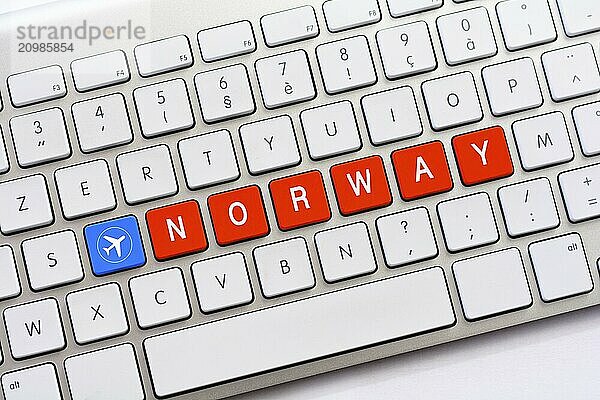 NORWAY writing on white keyboard with a aircraft sketch