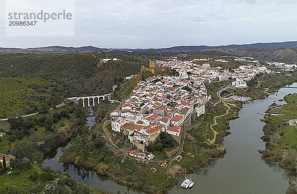 Mertola drone aerial view of the city and landscape with Guadiana river and medieval historic castle on the top in Alentejo  Portugal  Europe