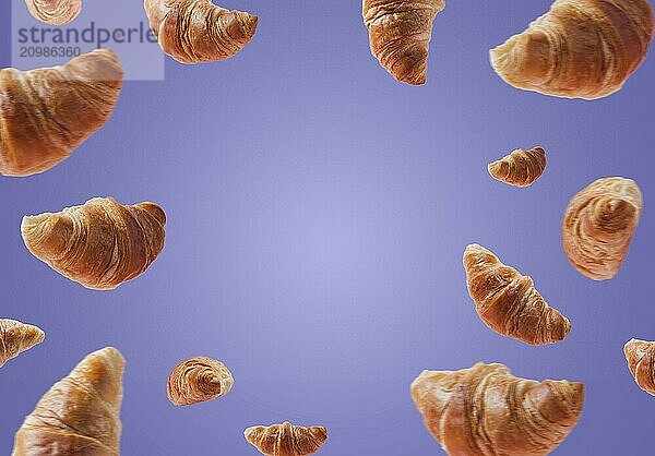 Freshly baked croissants levitating or flying. Set of croissants fly in air isolated on very pery purple background. Copy space. Signboard mockup  advertisement of bakery. Creative breakfast food