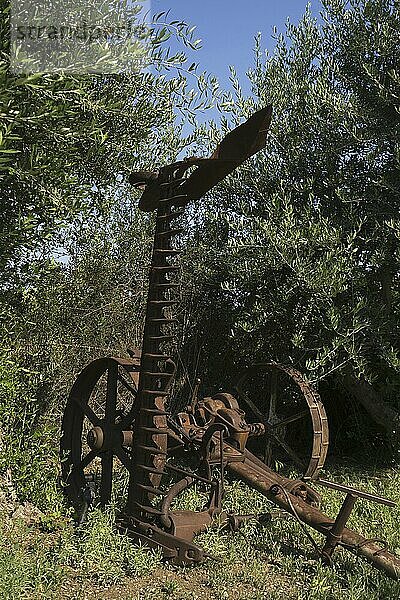 Ancient land plowing metal adjustment on wheels in Cyprus park