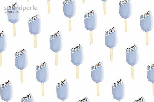 Isolated bitten blue cookie ice creams on a stick on white background. Flat lay with ice cream. Icecream pattern