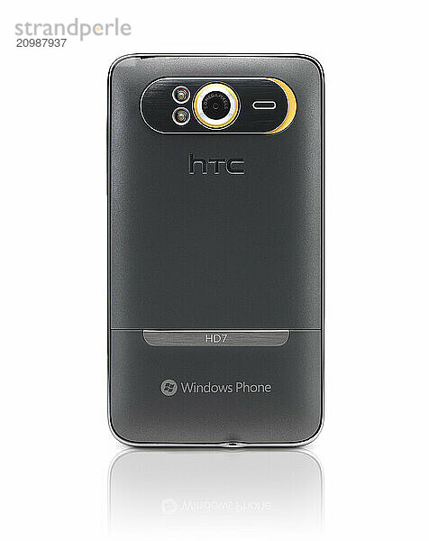 Windows 7 phone. HTC HD7 smartphone rear view isolated with clipping path on white background. High quality photo