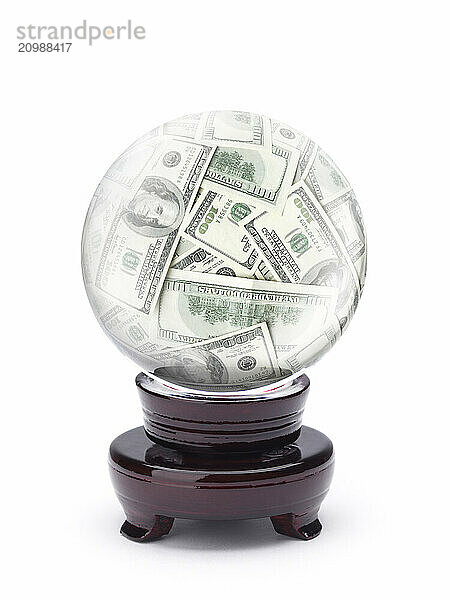 Money  US dollar bills inside a crystal ball isolated on white. Business and financial investment concept