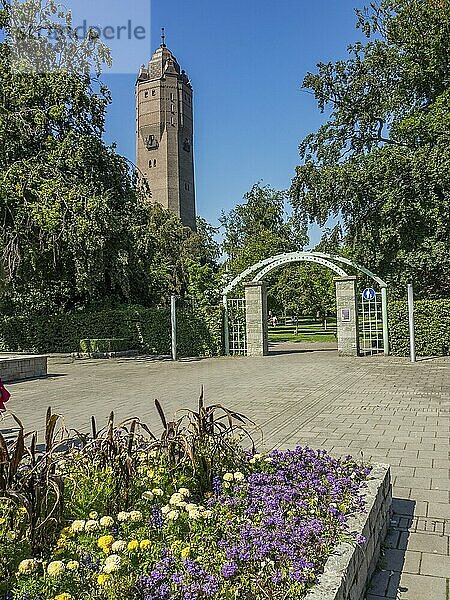 Garden hotel with flower beds and a high tower in the background  trelleborg  sweden  baltic sea  scandinavia