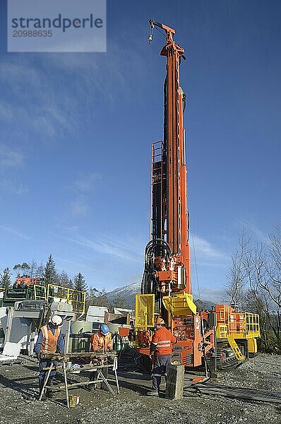 Drilling crewmen prepare to remove a core sample from a rig drilling near Greymouth  New Zealand  Oceania