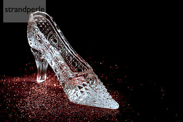 Crystal shoe on red conceptual still life