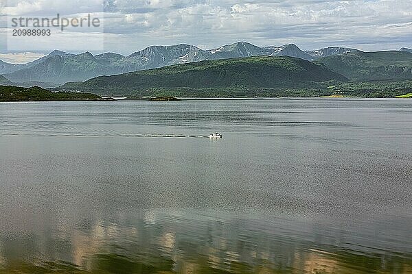 Panoramic mountain view with a boat sailing in the fjord in Molde  Norway  Europe