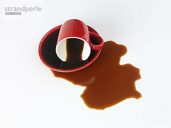 Spilled red coffee cup isolated on white background