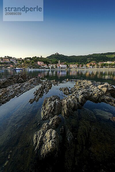 Collioure bay with rocks and beach at sunrise at Occitanie in France