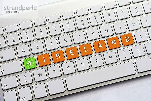 IRELAND writing on white keyboard with a aircraft sketch