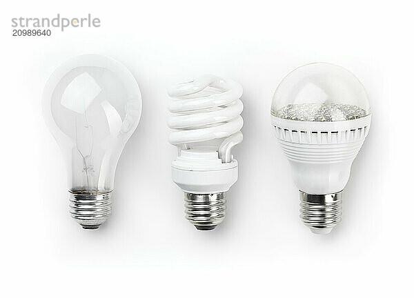 Three generations of light bulbs. Regular incandescent  energy saving fluorescent and LED isolated on white background with clipping path