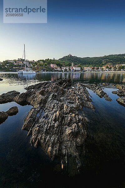 Collioure bay with rocks and beach at sunrise at Occitanie in France