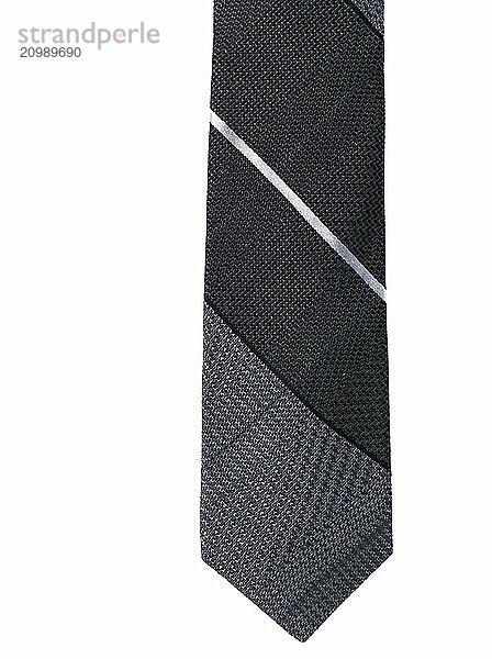 Closeup of stylish slim necktie with stripes. Mens tie isolated on white background