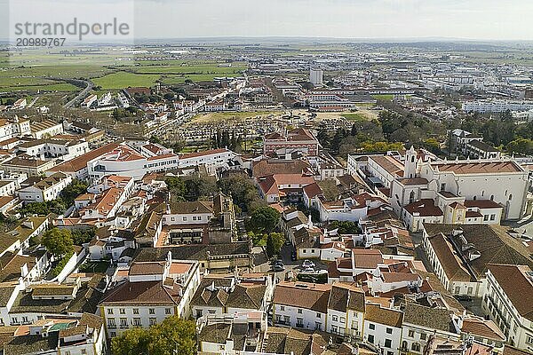 Evora drone aerial view on a sunny day with historic buildings city center and church in Alentejo  Portugal  Europe