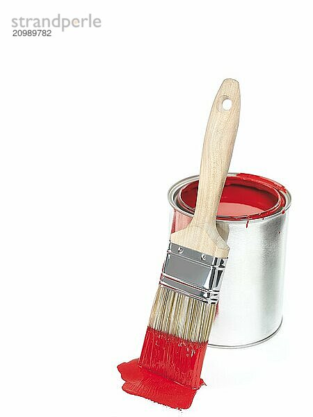 Open can of red paint and a paintbrush isolated on white background