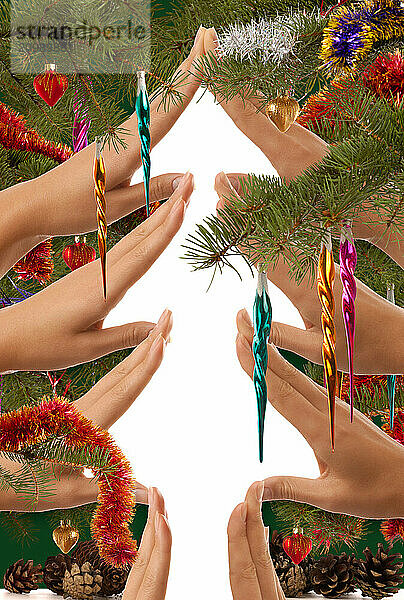 Creative Christmas tree made from hands on white background