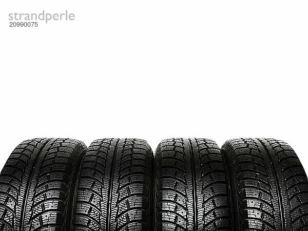 Set of winter tires  car snow tyres isolated on white background