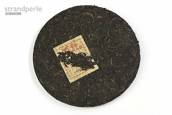 Puer  pu-er  Puer or Pu-erh  fermented ripened Chinese black tea isolated on white