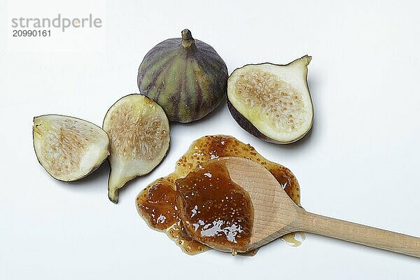 Fig jam in cooking spoon and fresh figs  Ficus carica