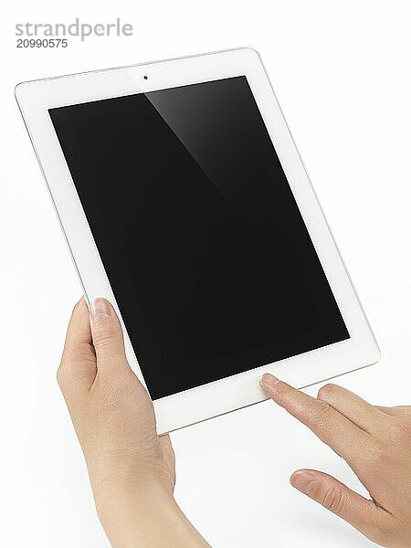 Young woman holding Apple iPad 2 tablet computer in her hands. Isolated on white background