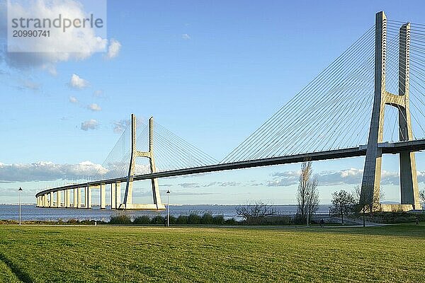 Ponte Vasco da Gama Bridge view from a garden park during the day