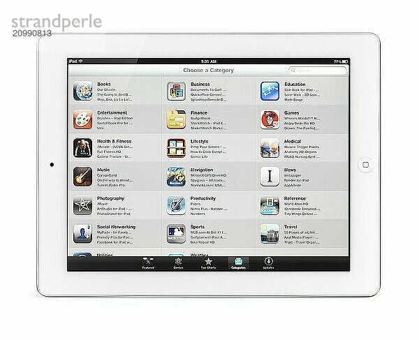 Apple iPad 2 tablet computer with app store categories on its display. Isolated with clipping path on white background