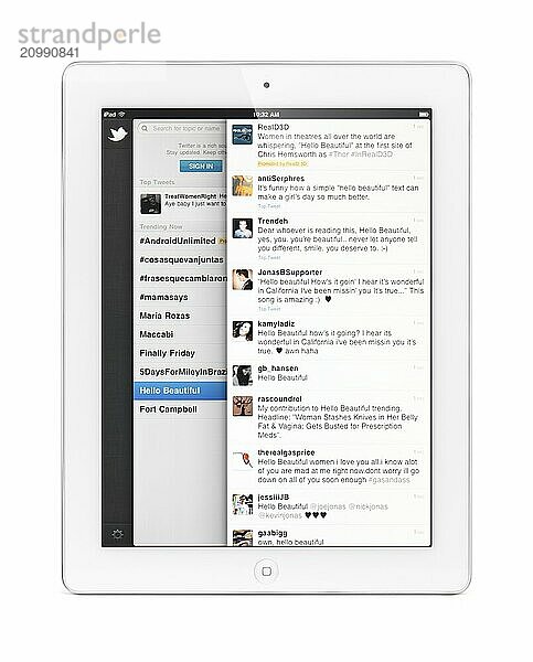 Apple iPad 2 tablet computer with Twitter  social networking service on its display. Isolated with clipping path on white background