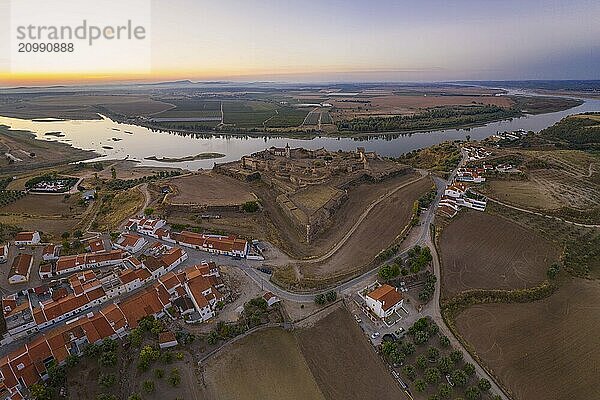 Juromenha castle  village and Guadiana river drone aerial view at sunset in Alentejo  Portugal and Spain on the background