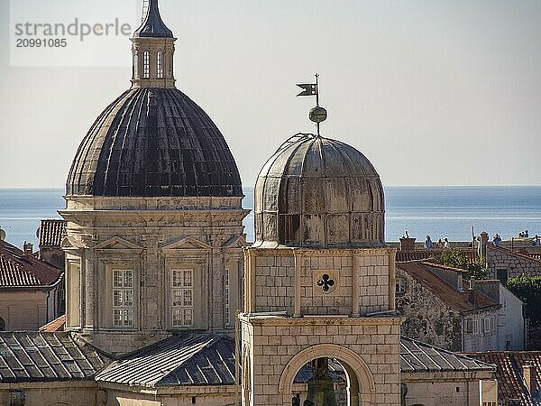 Church tower and dome of a historic church with a view of the sea and the city  dubrovnik  Mediterranean Sea  Croatia  Europe