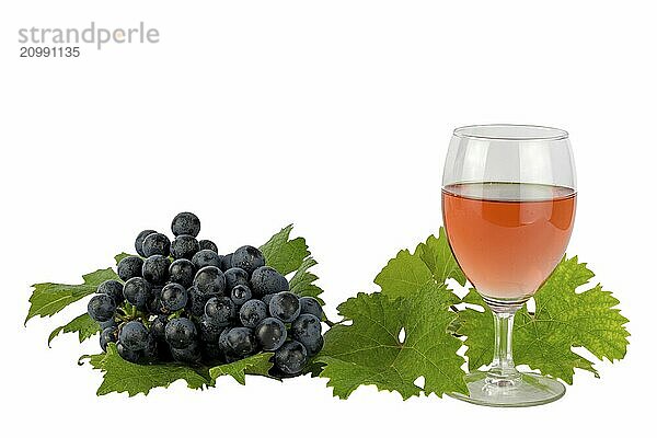 Rose wine with red Dornfelder grapes and vine leaves on white