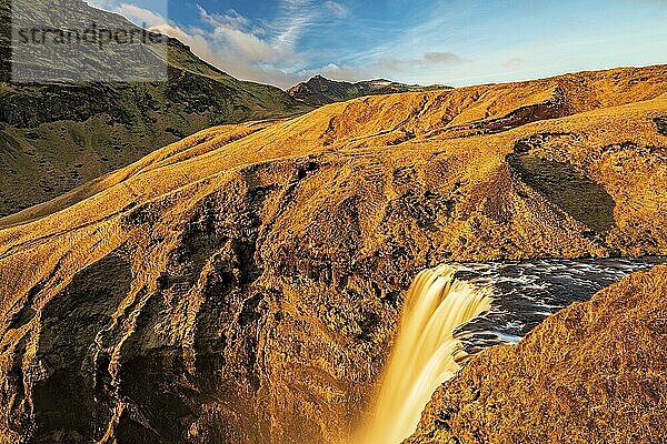 Beautiful Skogafoss waterfall during the summer season seen from the top  Iceland  Europe