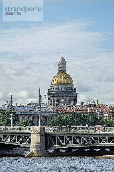 View of a magnificent cathedral with a golden dome and a bridge in the foreground on a sunny day  saint petersburg  baltic sea  russia