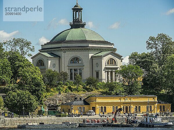 Church with large dome  surrounded by trees and a small park  beautiful summer day  stockholm  baltic sea  sweden  scandinavia