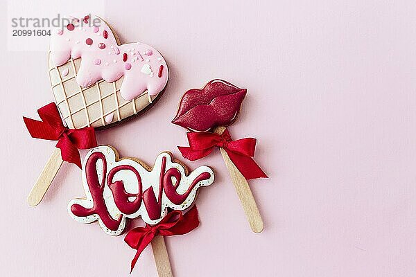 Gingerbread cookies love  lips  heart ice cream. Valentine card. Pink background.