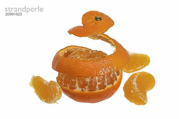 Tangerine peels off in a stripe all round against a white background