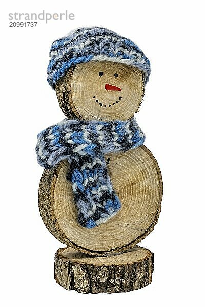 Handmade snowman made from wooden discs  with crocheted hat and scarf on a white background