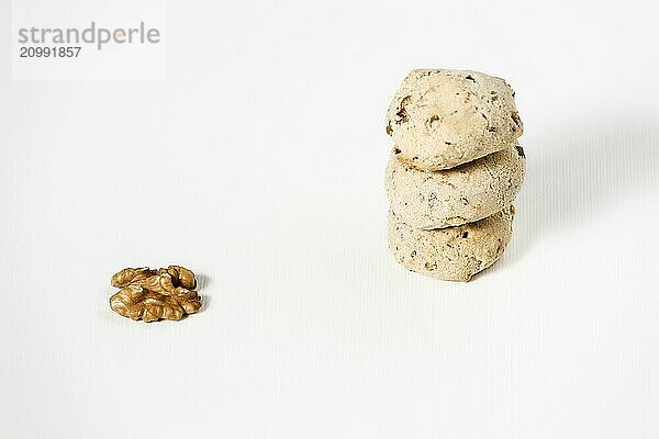 Cavallucci  typical Italian biscuits with walnut and candied fruit on a white background