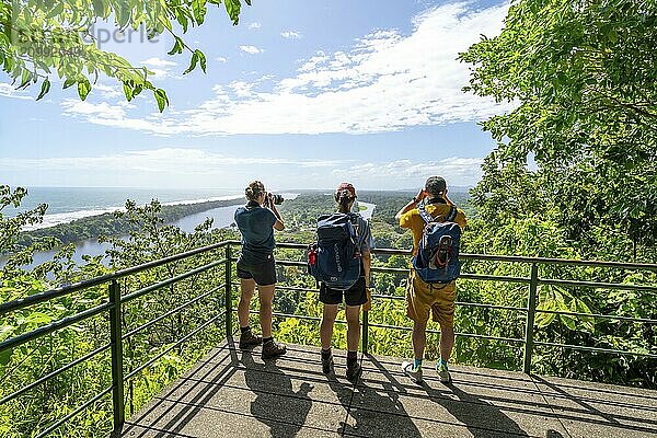 Tourists look out over the rainforest from Cerro Tortuguero  Tortuguero National Park  Costa Rica  Central America