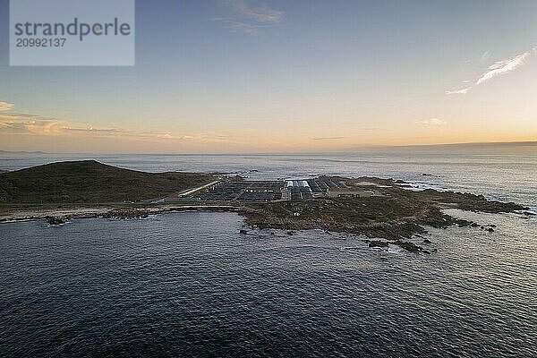 Amazing drone aerial landscape view of a Sea fishing farm on land at sunset in Galiza  Spain  Europe