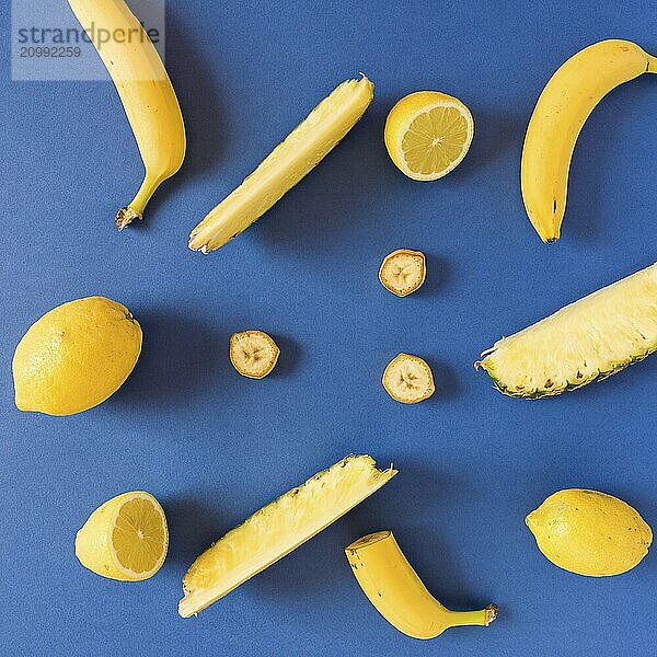 Yellow colored fruit over a blue background